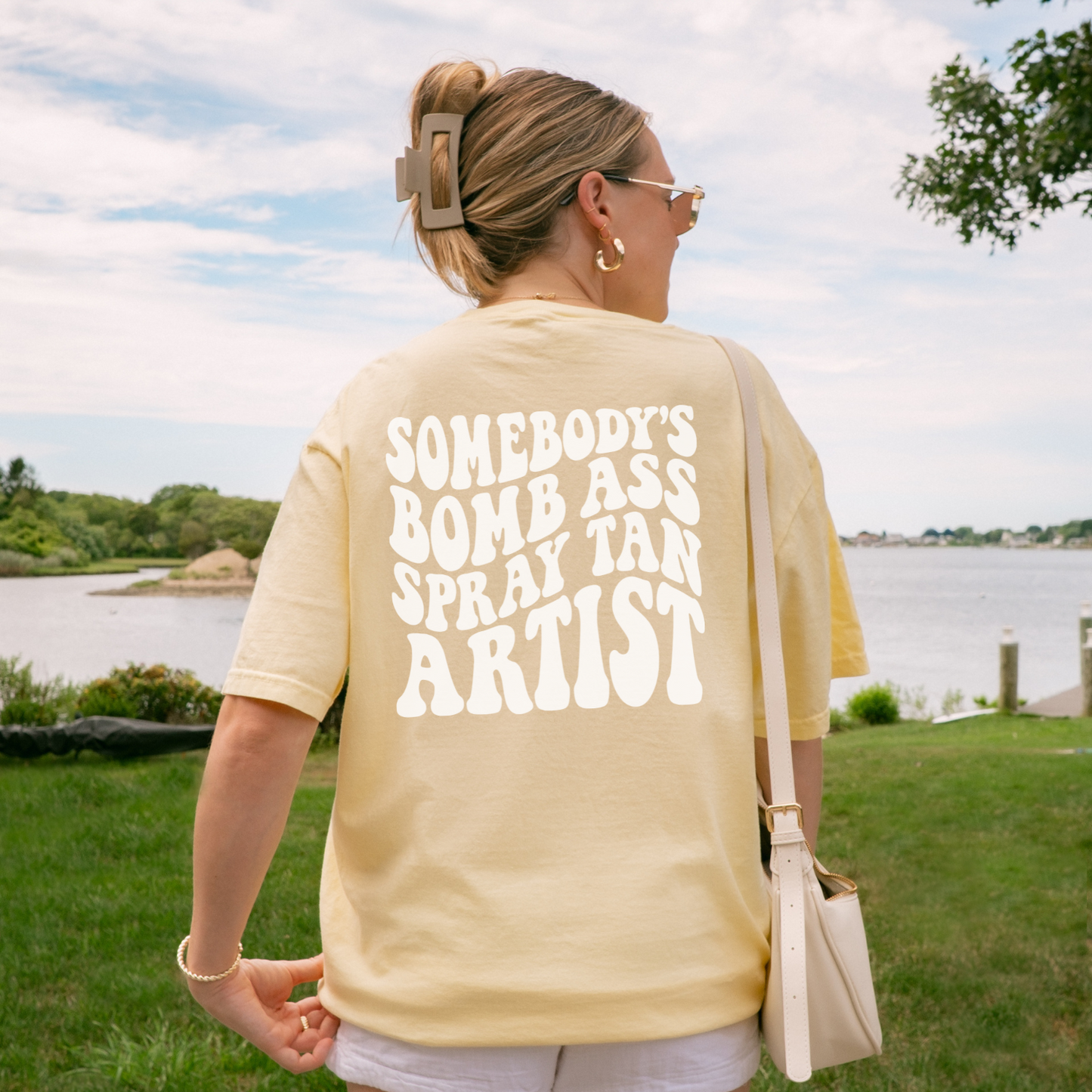 Somebody's Bomb Ass Spray Tan Artist Graphic Tee