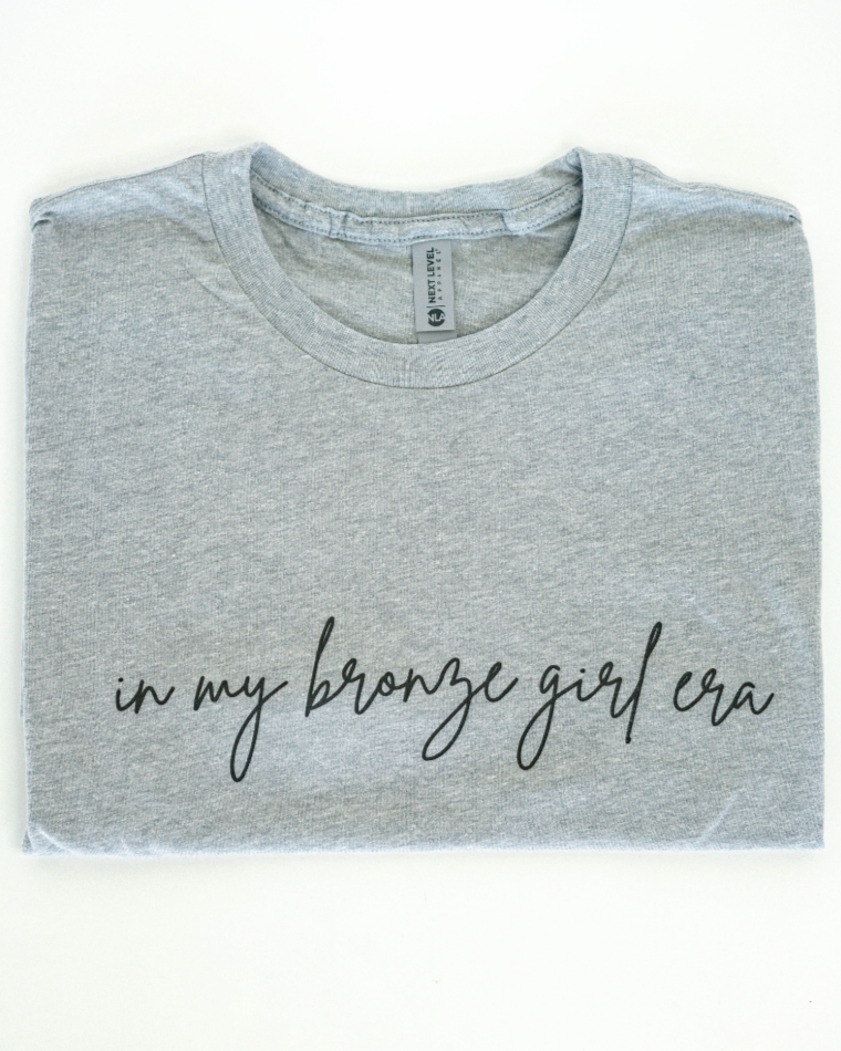 In My Bronze Girl Era Graphic Tee (OG Collection)