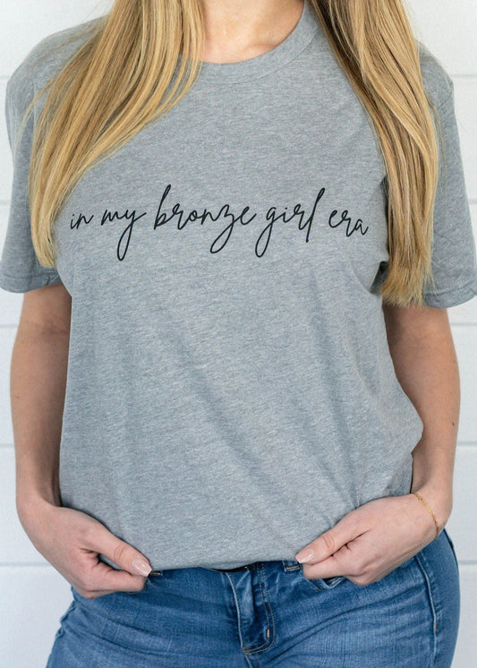 In My Bronze Girl Era Graphic Tee (OG Collection)
