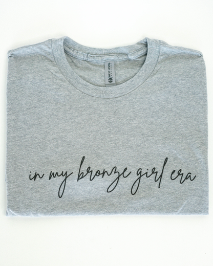In My Bronze Girl Era Graphic Tee (OG Collection)